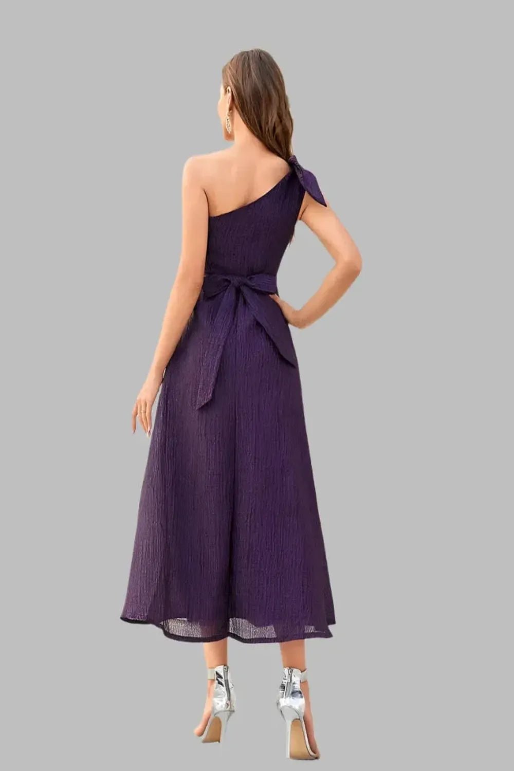  A Diagonal Neck Violet Slim Woven Dress featuring a stylish diagonal neckline and a fitted silhouette displayed on a mannequin against a neutral background.