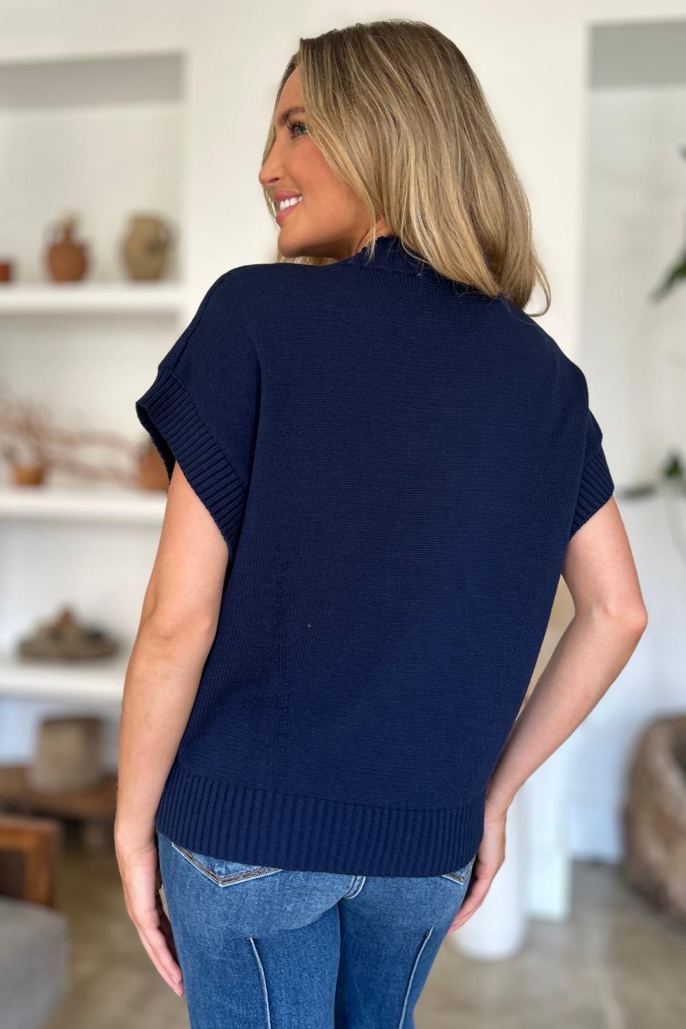  A light gray Double Take full size mock neck short sleeve sweater displayed on a mannequin featuring a relaxed fit and soft texture.