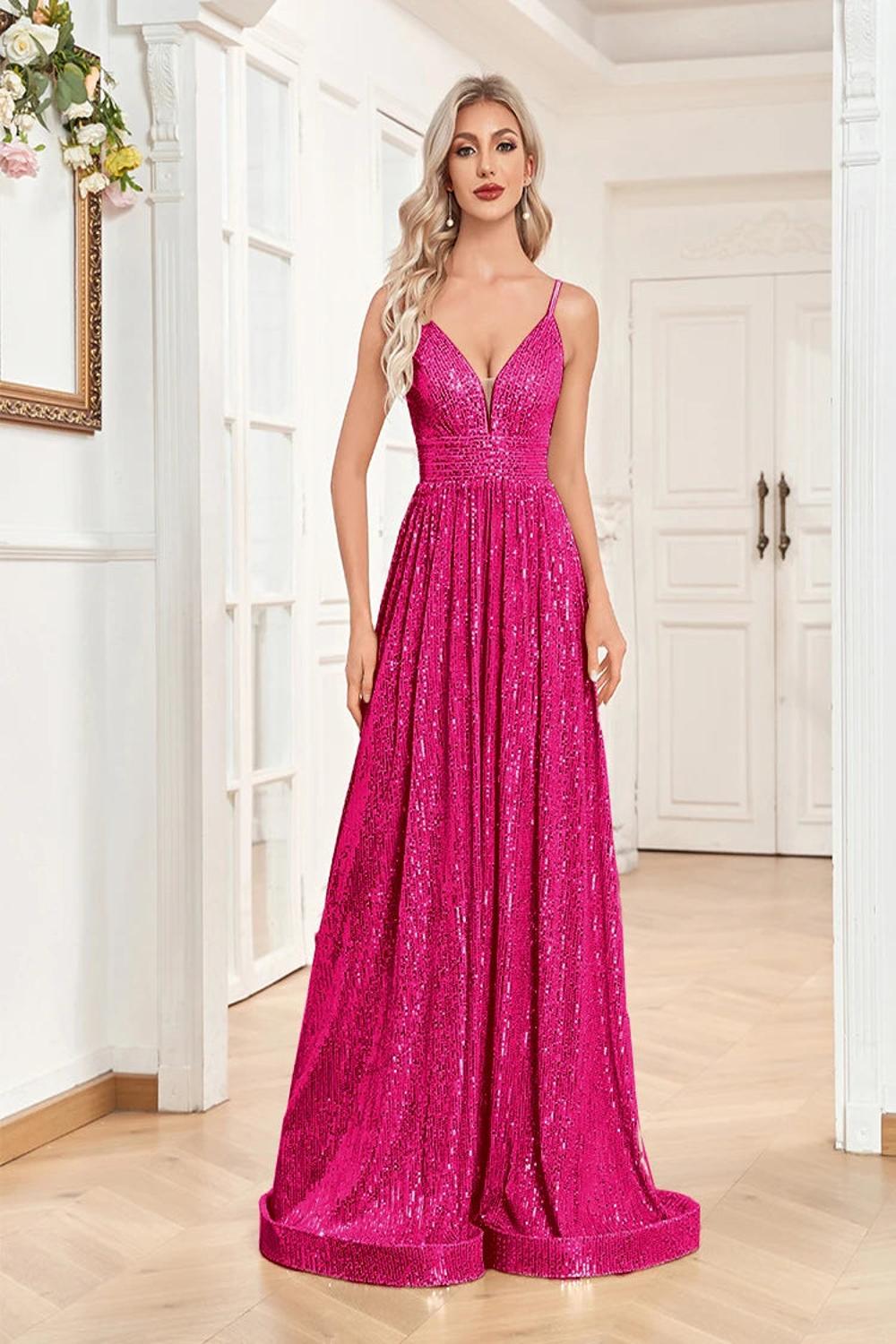 An elegant backless mermaid evening gown adorned with sequins featuring a fitted silhouette that flares at the bottom.