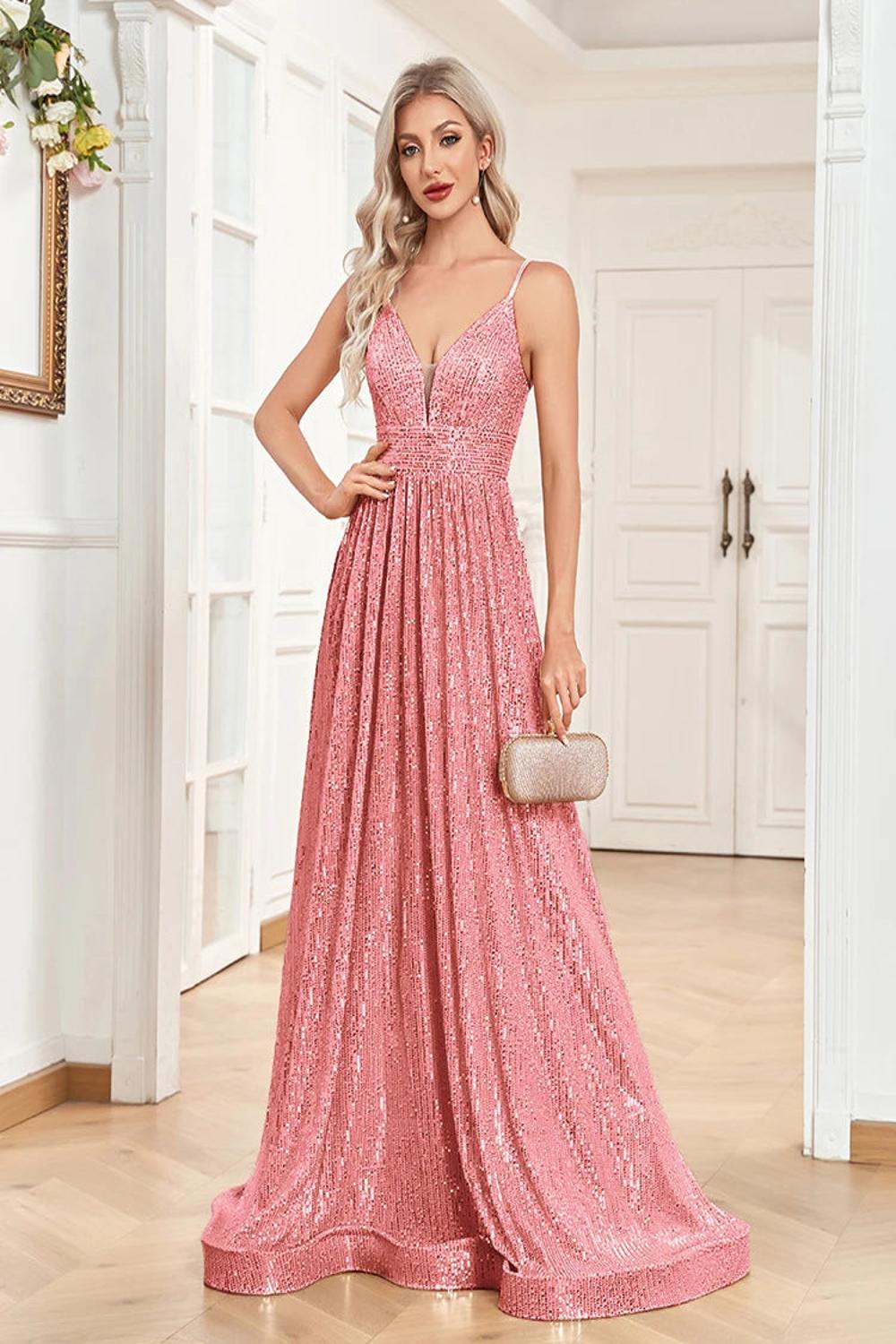 An elegant backless mermaid evening gown adorned with sequins featuring a fitted silhouette that flares at the bottom.