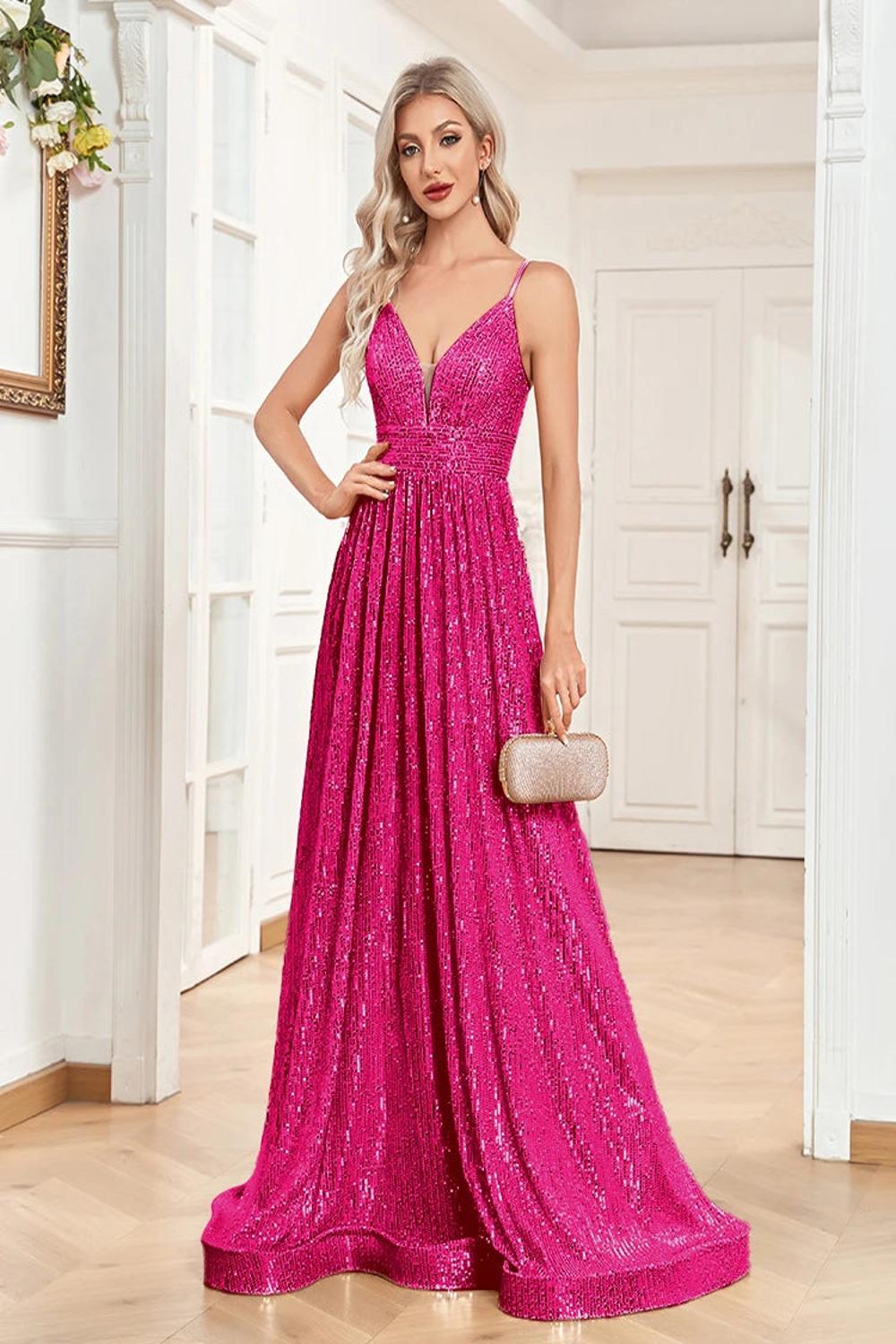 An elegant backless mermaid evening gown adorned with sequins featuring a fitted silhouette that flares at the bottom.