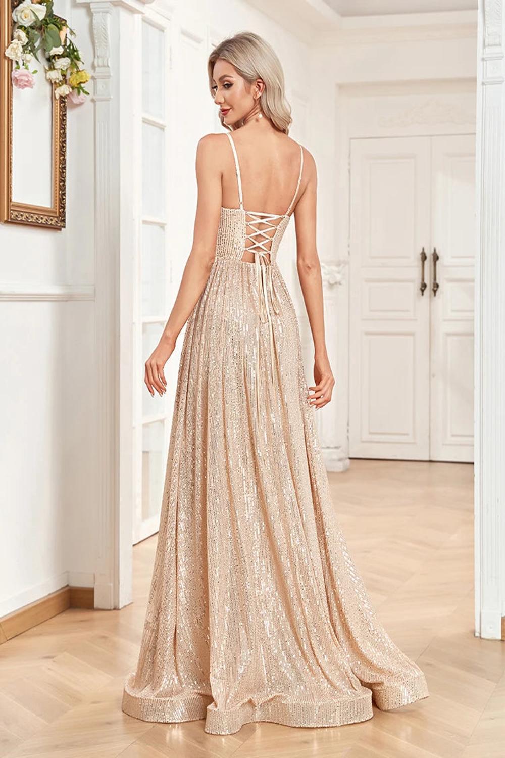 An elegant backless mermaid evening gown adorned with sequins featuring a fitted silhouette that flares at the bottom.