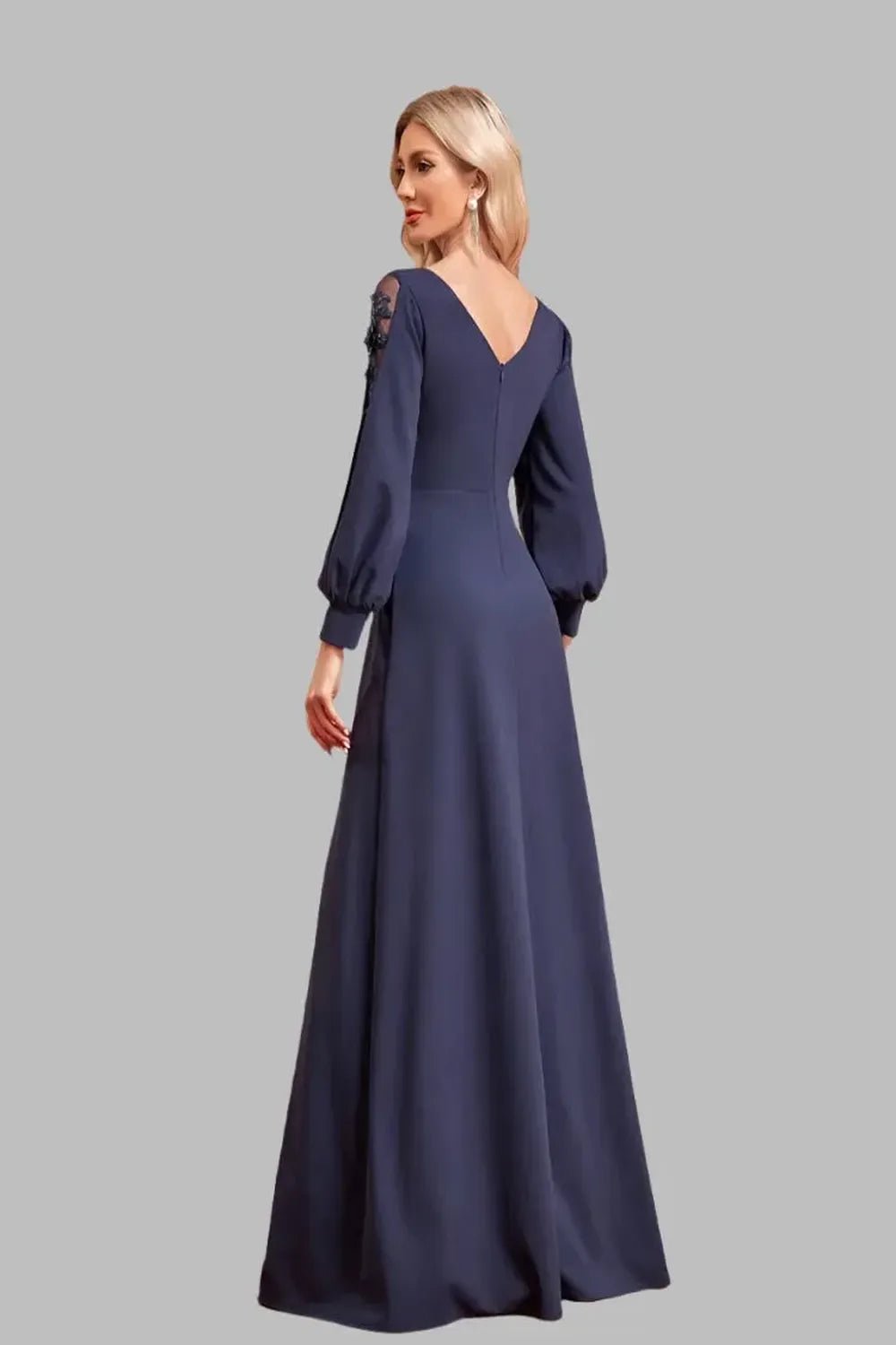 Elegant floorlength dress with long sleeves and a Vneck design featuring a flowing silhouette and sophisticated fabric.