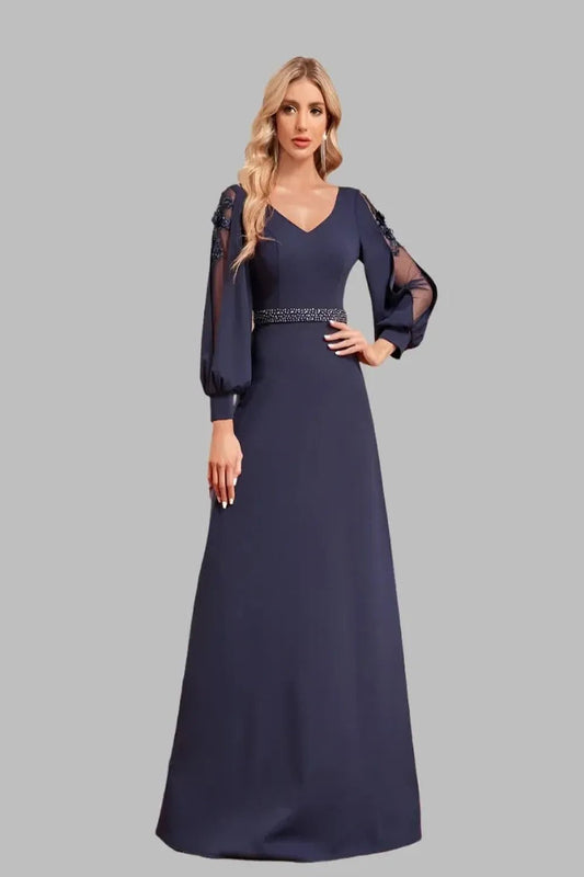 Elegant floorlength dress with long sleeves and a Vneck design featuring a flowing silhouette and sophisticated fabric.