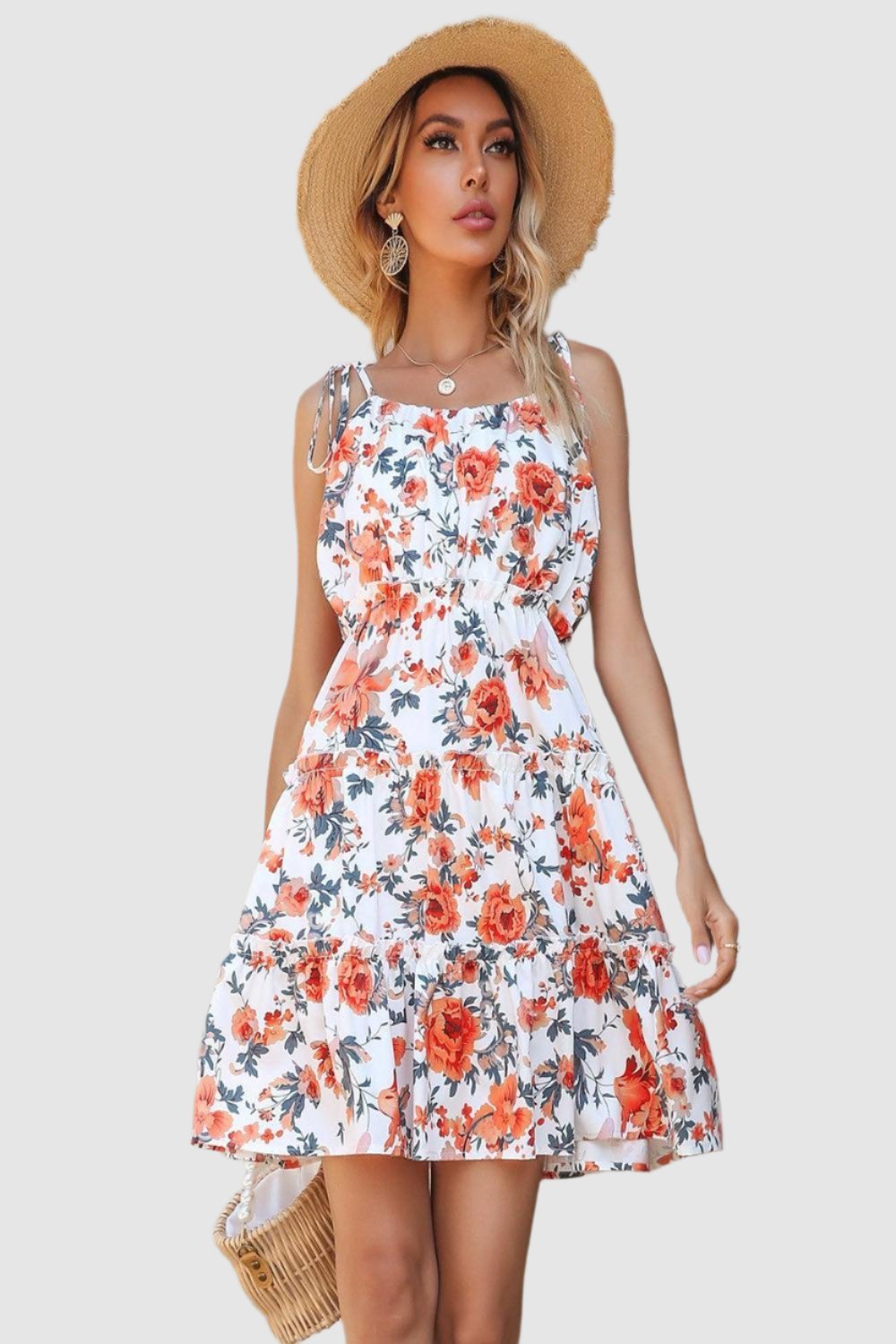  Floral tiered spaghetti strap dress featuring a vibrant floral pattern delicate straps and a flowing silhouette ideal for summer wear.