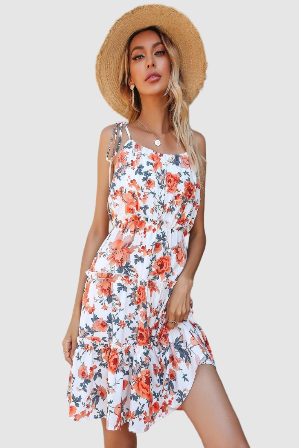  Floral tiered spaghetti strap dress featuring a vibrant floral pattern delicate straps and a flowing silhouette ideal for summer wear.