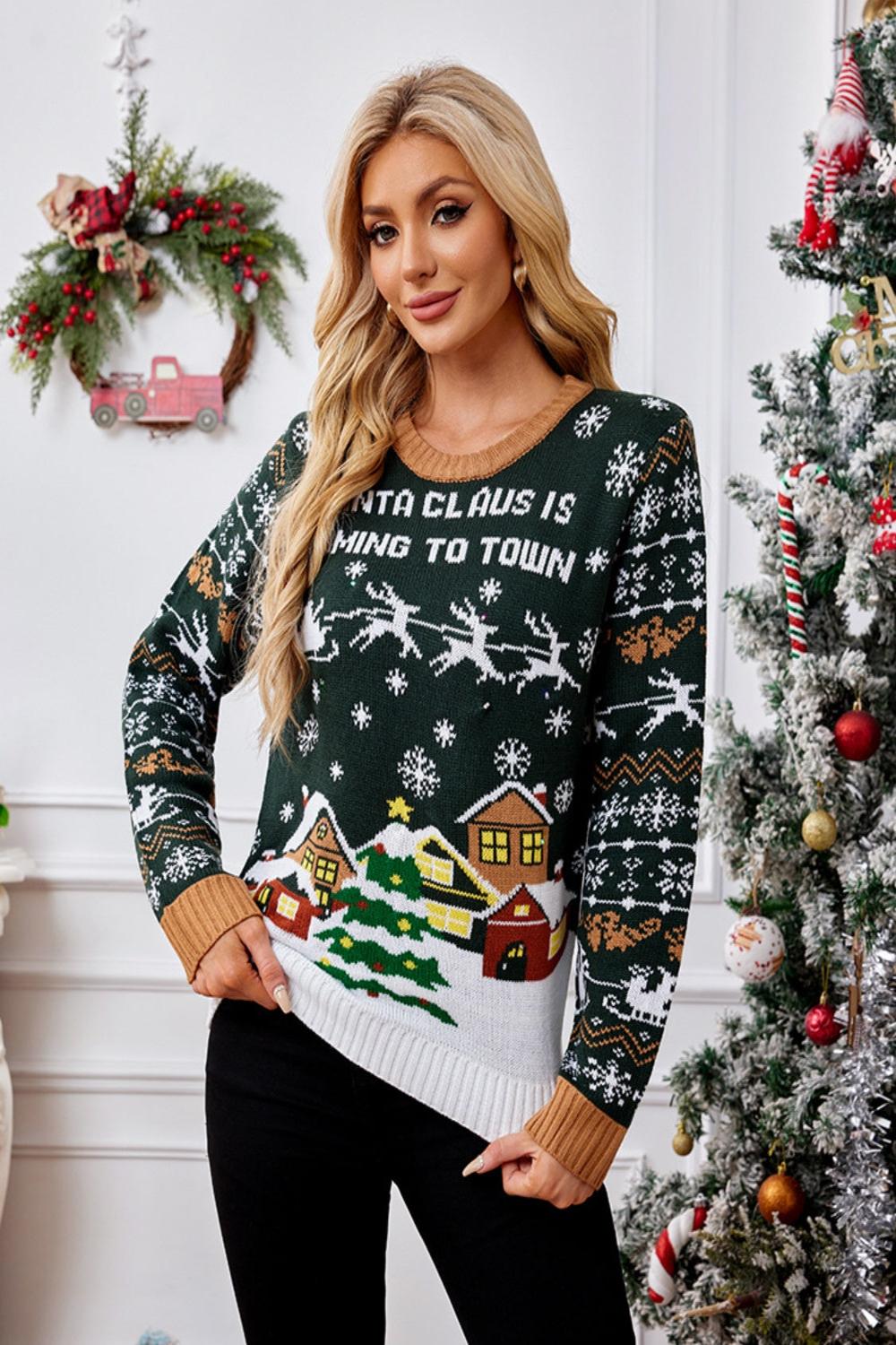  Graphic round neck long sleeve sweater featuring a colorful design and a relaxed fit displayed on a hanger against a neutral background.