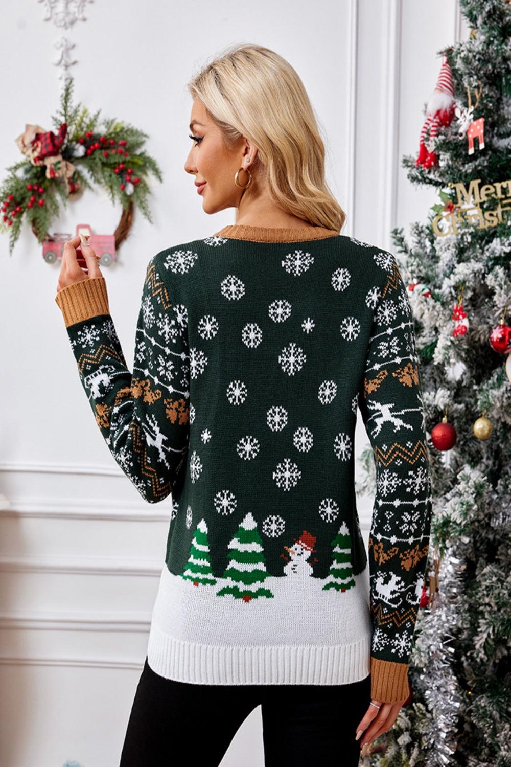  Graphic round neck long sleeve sweater featuring a colorful design and a relaxed fit displayed on a hanger against a neutral background.