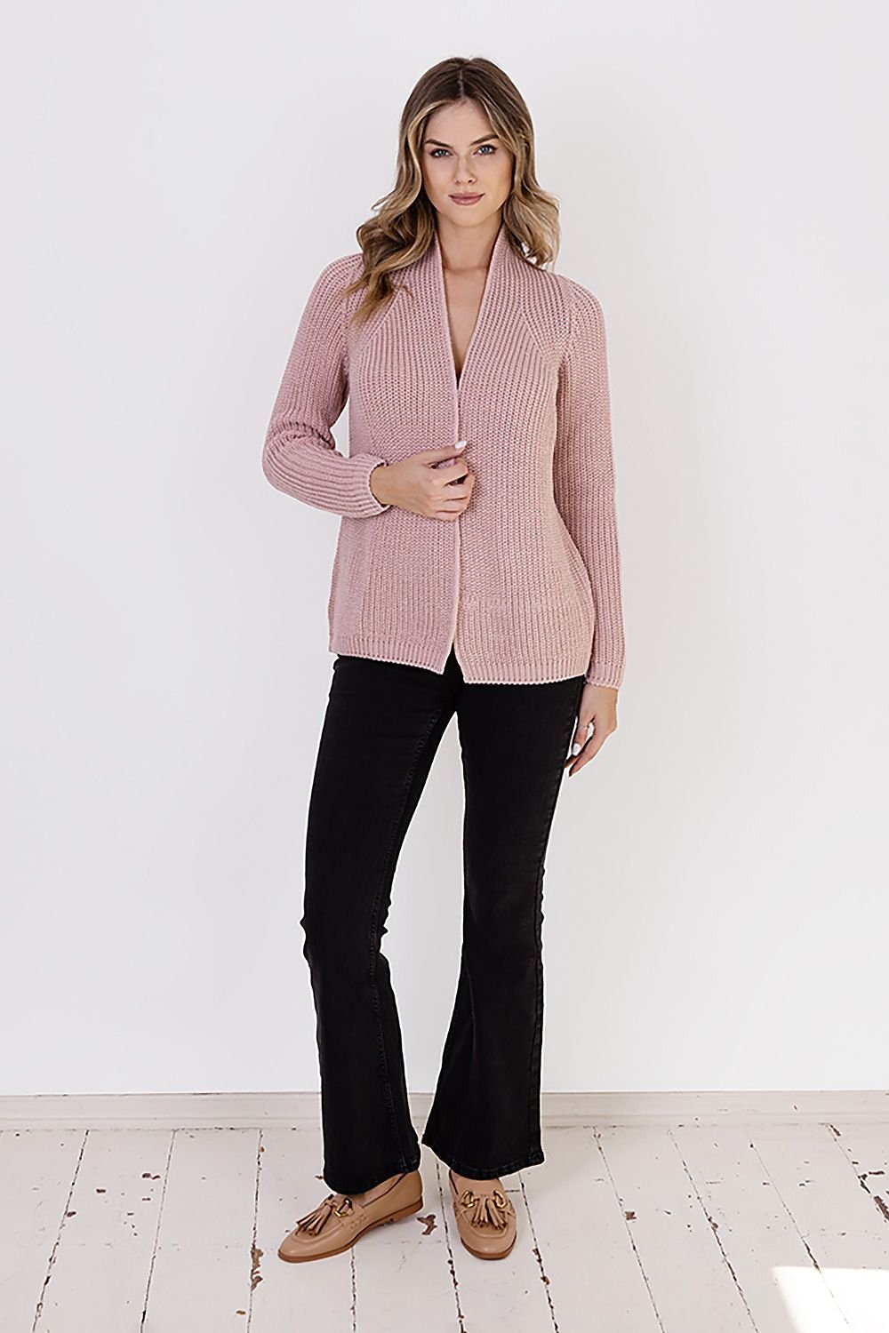  A ribbed cardigan featuring a standup collar showcasing a textured knit design in a neutral color.