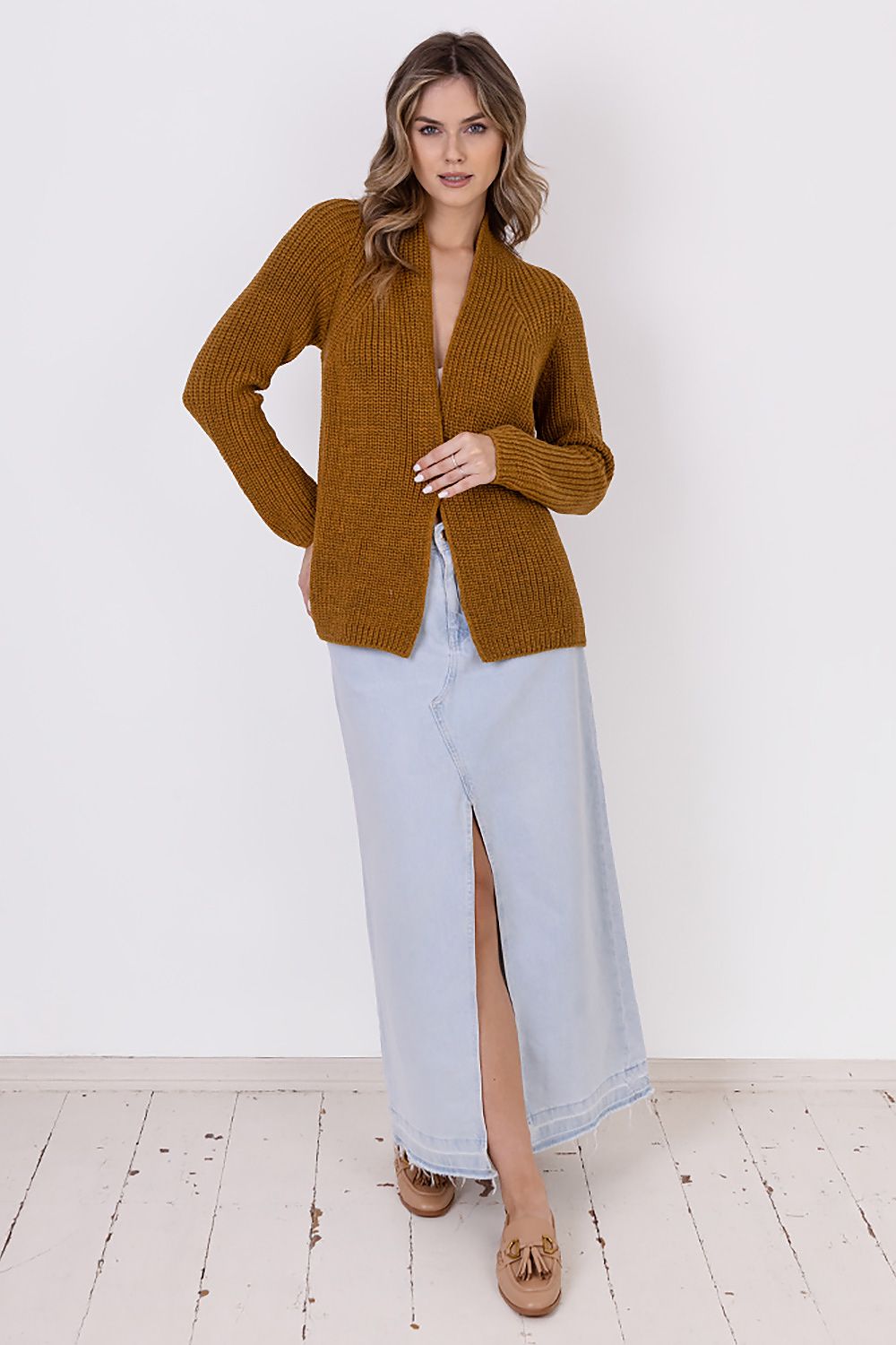  A ribbed cardigan featuring a standup collar showcasing a textured knit design in a neutral color.