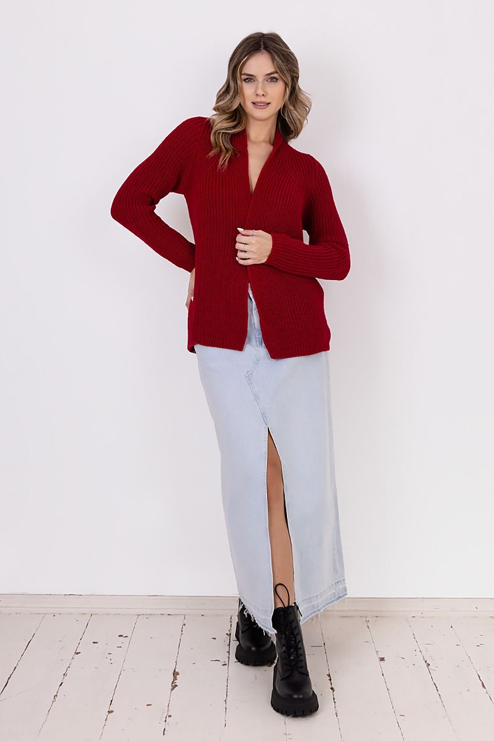  A ribbed cardigan featuring a standup collar showcasing a textured knit design in a neutral color.