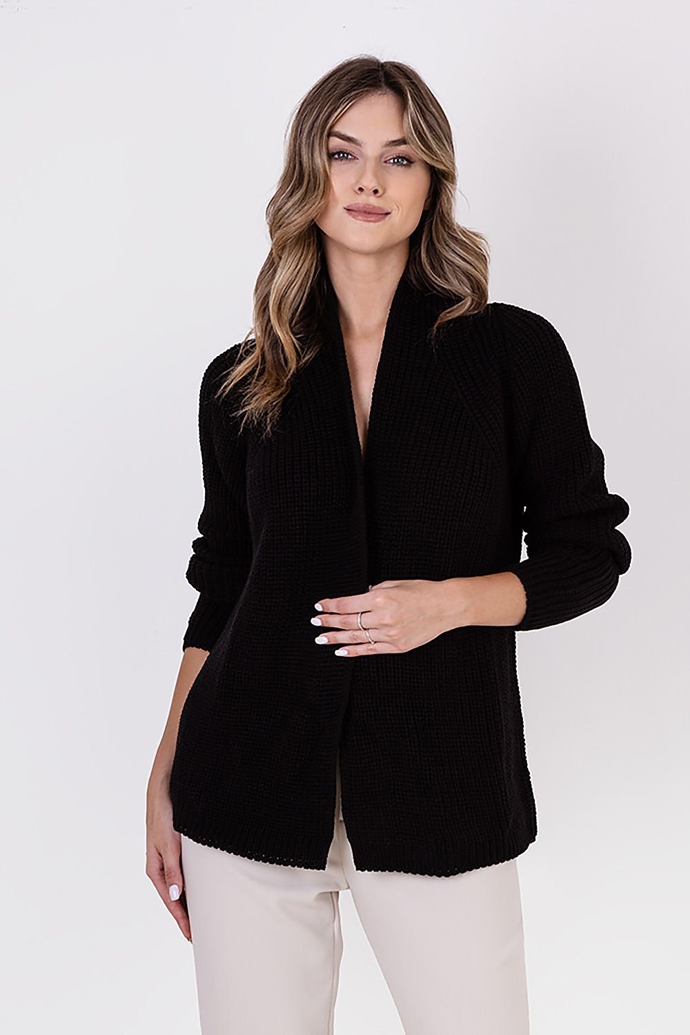  A ribbed cardigan featuring a standup collar showcasing a textured knit design in a neutral color.