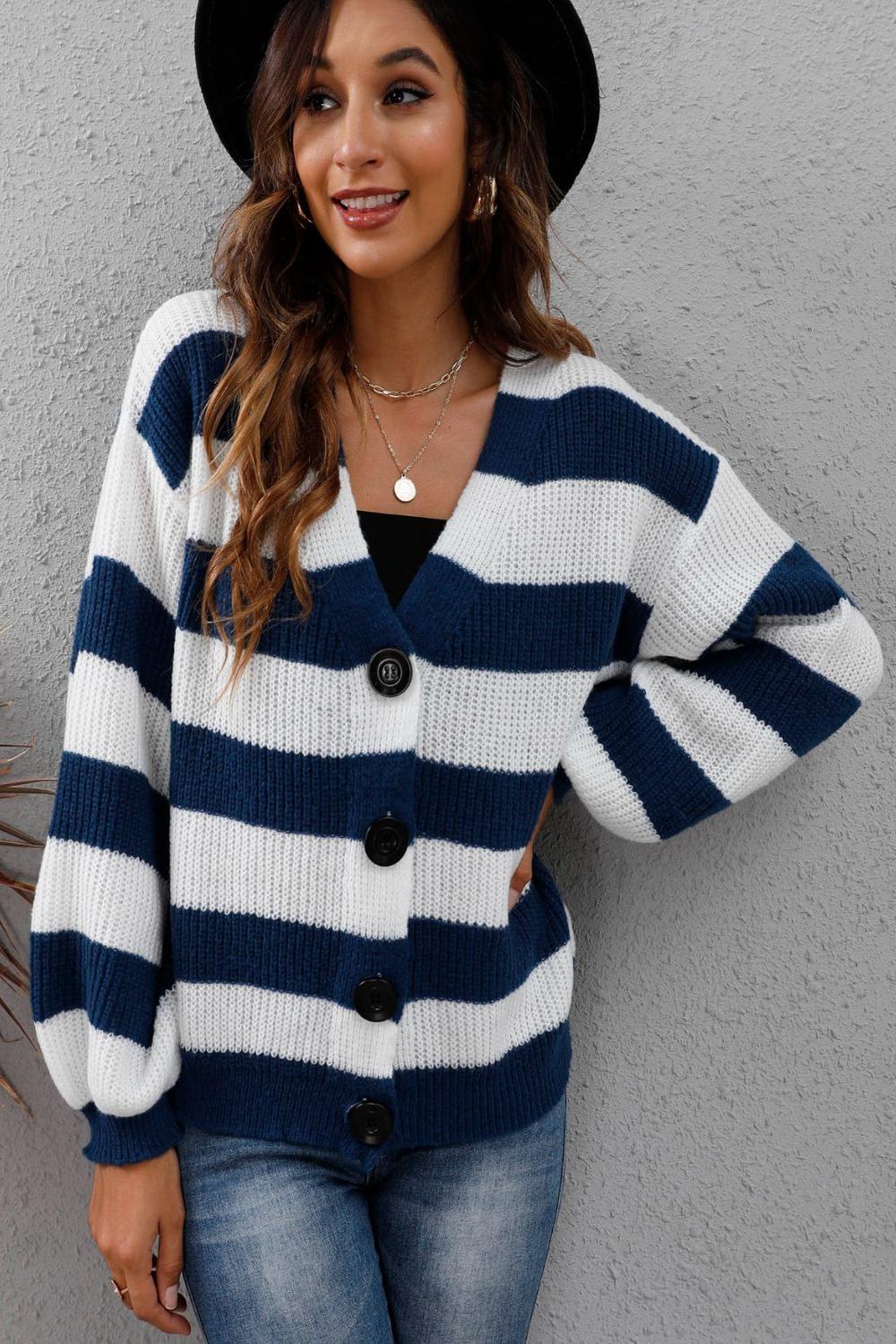 Striped long sleeve buttonup sweater featuring a mix of vibrant colors and a classic collar displayed on a neutral background.