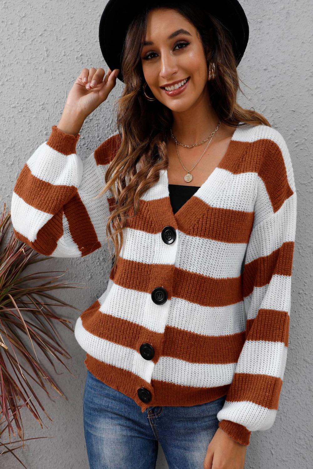 Striped long sleeve buttonup sweater featuring a mix of vibrant colors and a classic collar displayed on a neutral background.