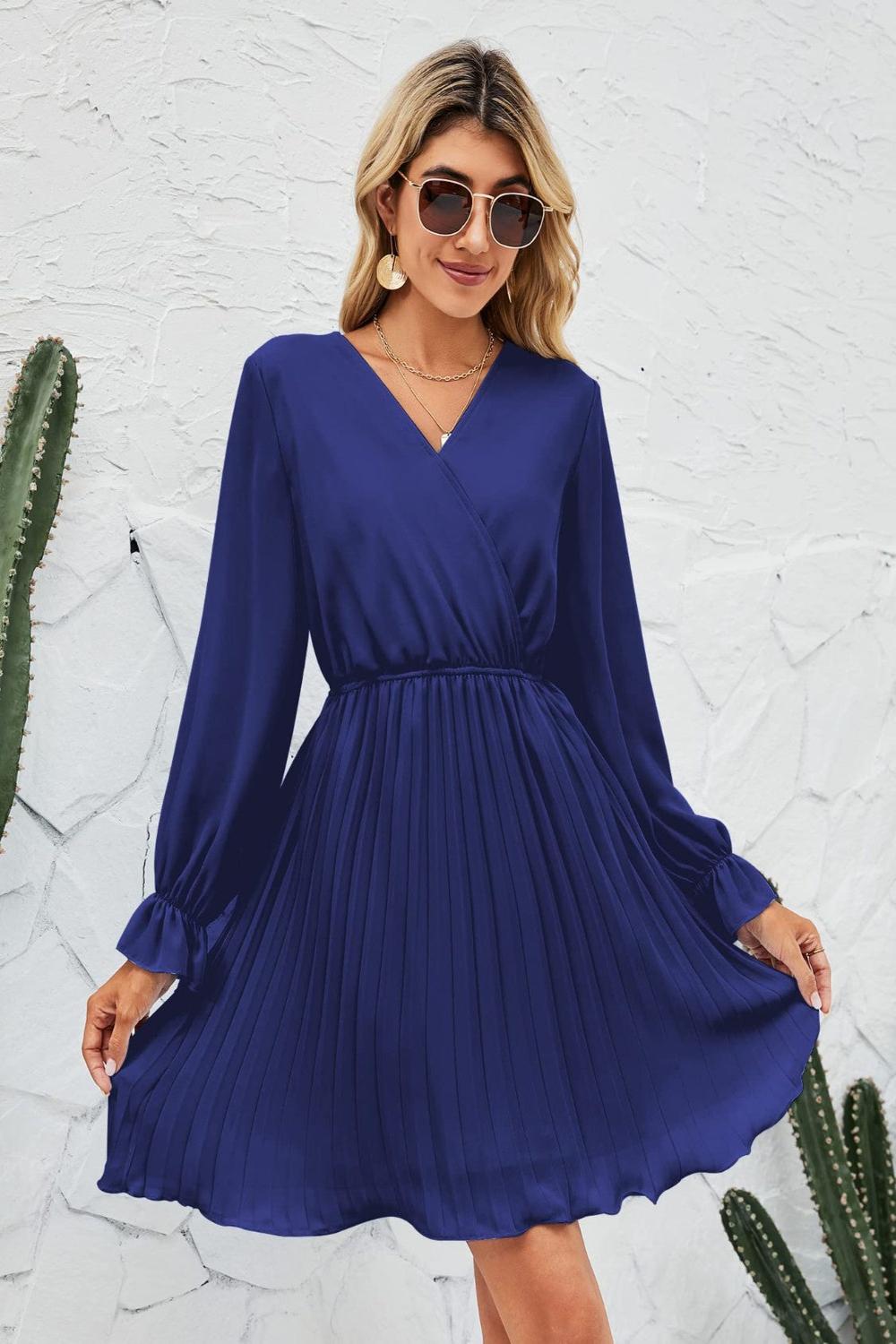  A stylish surplice flounce sleeve pleated mini dress in a vibrant color featuring a deep Vneckline flowing fl.