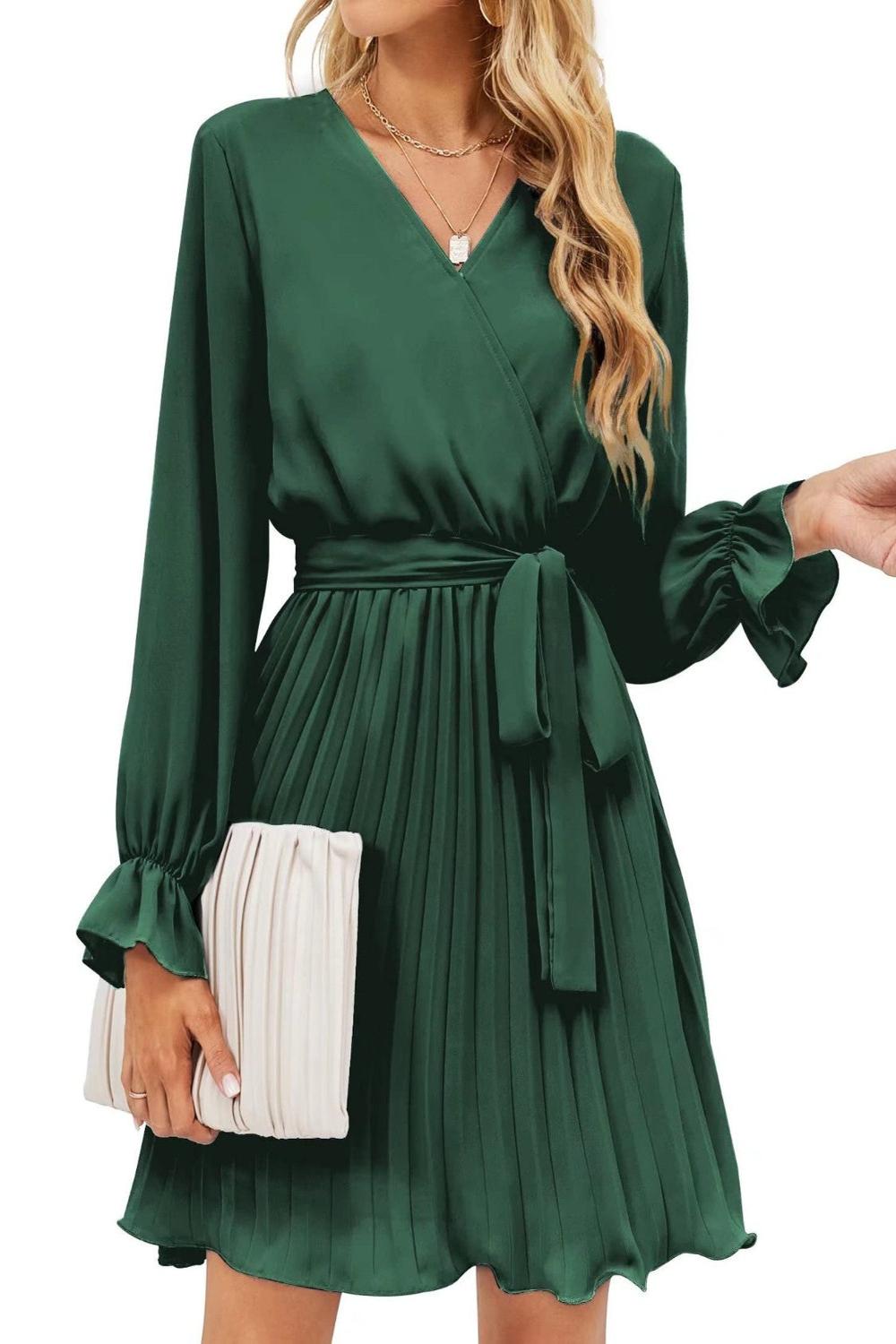  A stylish surplice flounce sleeve pleated mini dress in a vibrant color featuring a deep Vneckline flowing fl.