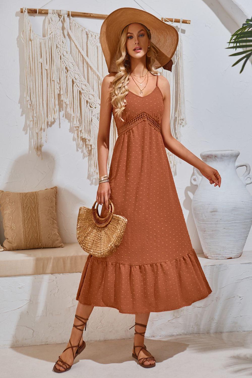 Elegant Swiss Dot VNeck Cami Dress featuring a lightweight textured fabric with delicate dot patterns adjustable spaghetti straps and a flowing silhouette.