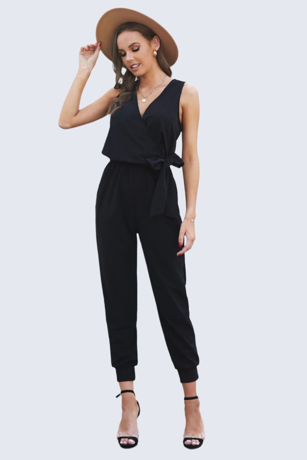 Stylish tied surplice neck sleeveless jumpsuit with a flattering fit, perfect for both casual outings and chic events.