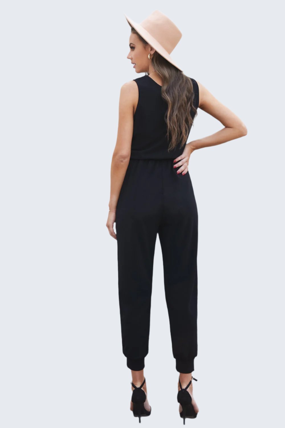 Stylish tied surplice neck sleeveless jumpsuit with a flattering fit, perfect for both casual outings and chic events.