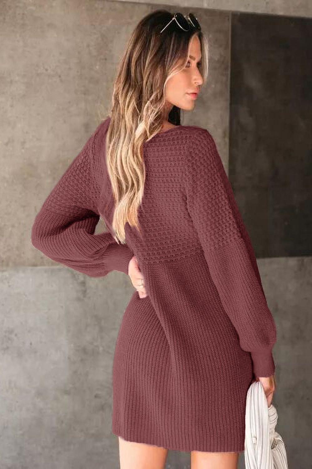 A cozy Vneck long sleeve sweater in a soft knit fabric featuring ribbed cuffs and hem displayed on a neutral background.