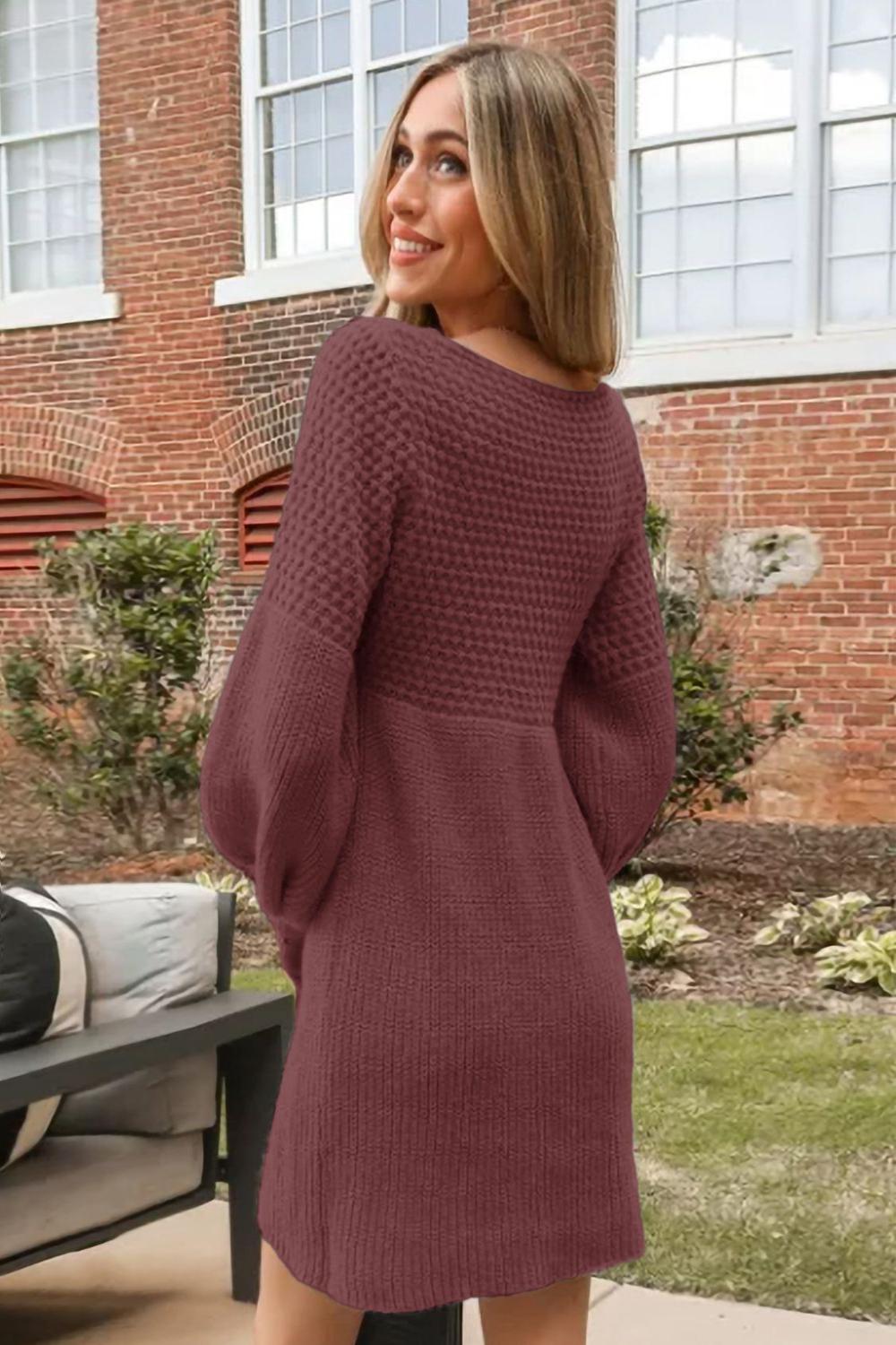 A cozy Vneck long sleeve sweater in a soft knit fabric featuring ribbed cuffs and hem displayed on a neutral background.