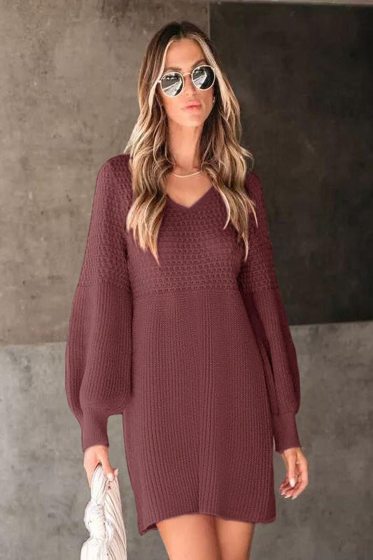 A cozy Vneck long sleeve sweater in a soft knit fabric featuring ribbed cuffs and hem displayed on a neutral background.