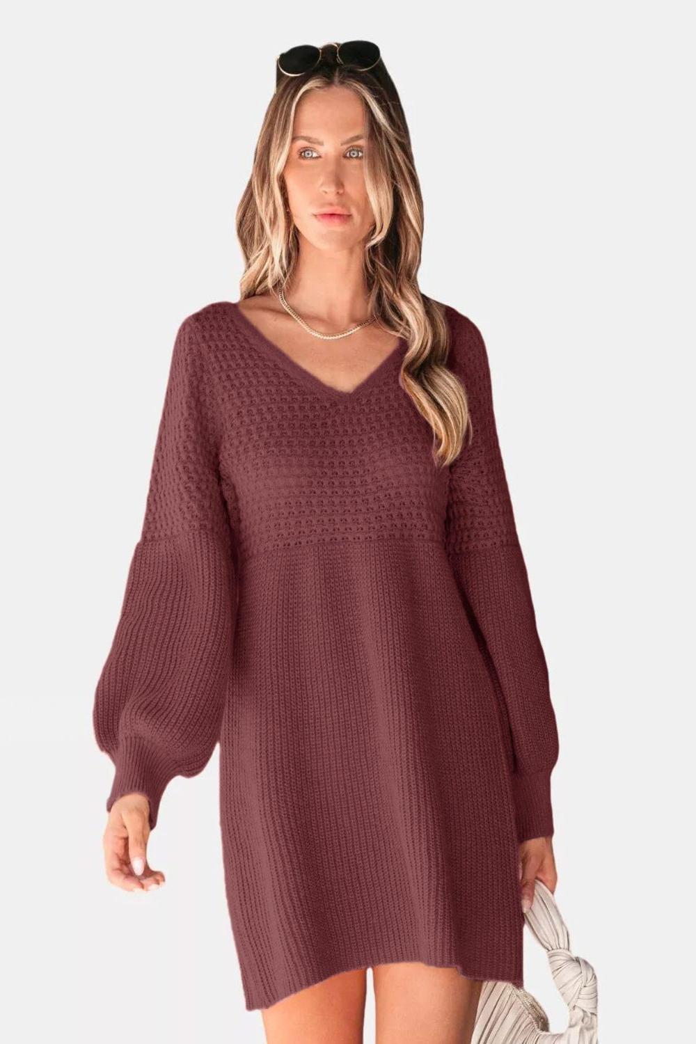 A cozy Vneck long sleeve sweater in a soft knit fabric featuring ribbed cuffs and hem displayed on a neutral background.